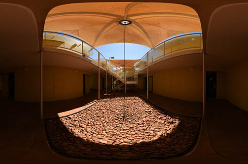 Inside lower level of an accommadation wing of sails resort, photographed as a 360 degree panorama.